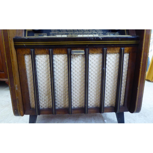 40 - A vintage Aristrona freestanding valve radiogram, in a wood veneered case  34