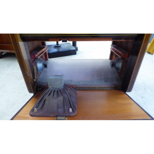 40 - A vintage Aristrona freestanding valve radiogram, in a wood veneered case  34