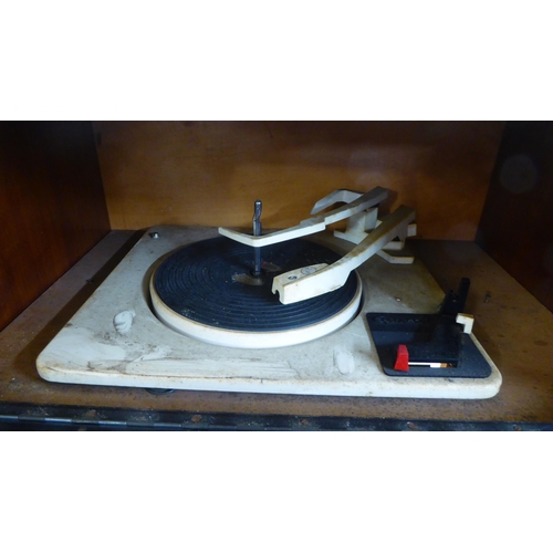 40 - A vintage Aristrona freestanding valve radiogram, in a wood veneered case  34