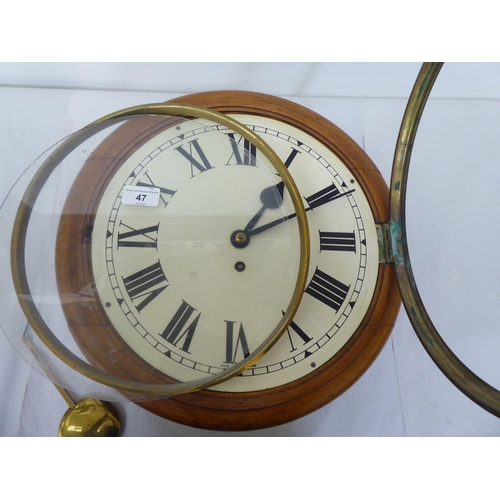 47 - A late Victorian oak cased wall timepiece; the movement faced by a Roman dial  15