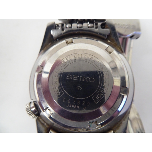 5 - A Seiko World Time automatic stainless steel cased bracelet watch, faced by a black baton dial