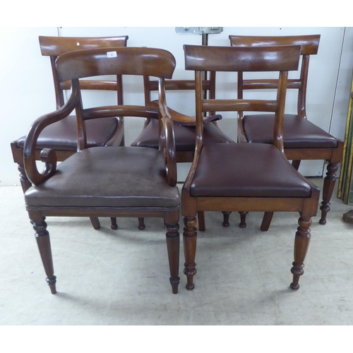 63 - A set of four late Regency mahogany framed, curved bar back dining chairs with upholstered seat pads... 