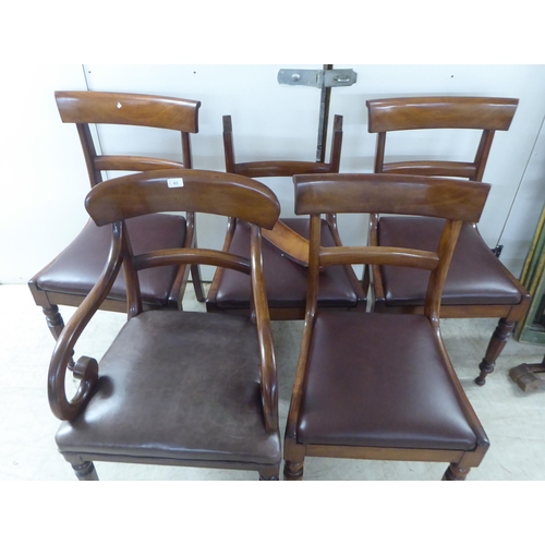 63 - A set of four late Regency mahogany framed, curved bar back dining chairs with upholstered seat pads... 