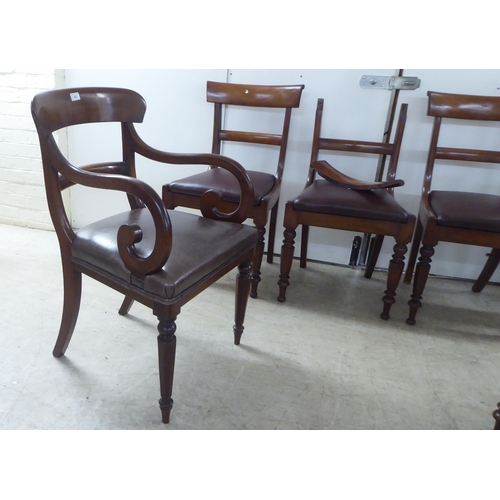 63 - A set of four late Regency mahogany framed, curved bar back dining chairs with upholstered seat pads... 