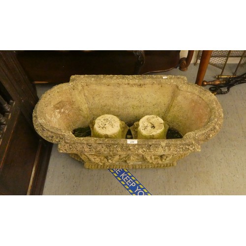 227 - A composition stone garden trough with mask motifs  12