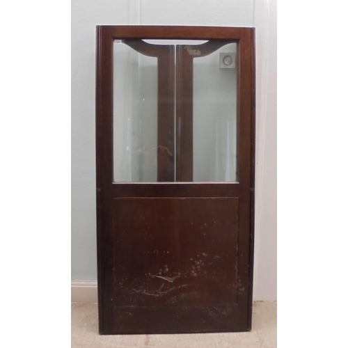 121 - A 19thC mahogany framed three-fold room screen with clear glazed upper panels  64