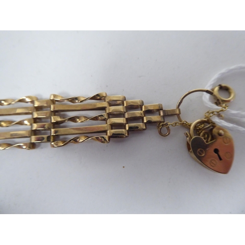 138 - A 9ct gold fancy gate link bracelet, on a padlock clasp and safety chain  boxed