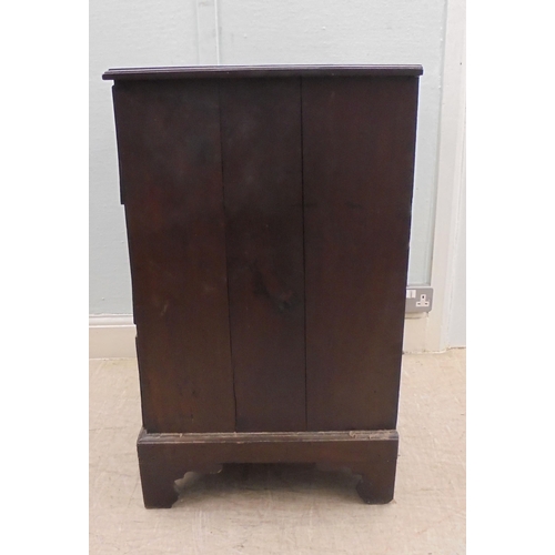 140 - A 19thC mahogany three deep drawer pedestal chest with cast brass bail handles, raised on bracket fe... 