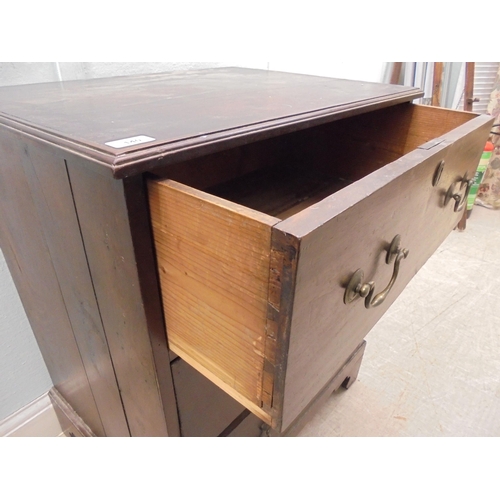 140 - A 19thC mahogany three deep drawer pedestal chest with cast brass bail handles, raised on bracket fe... 