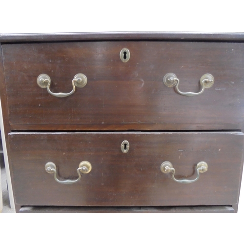 140 - A 19thC mahogany three deep drawer pedestal chest with cast brass bail handles, raised on bracket fe... 