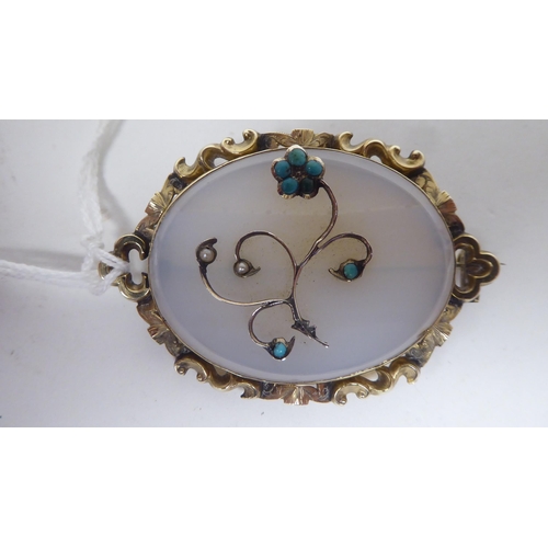 145 - A Victorian gold framed, (probably 15ct) oval tablet brooch  stamped 1848  Reg.AP22 and th... 