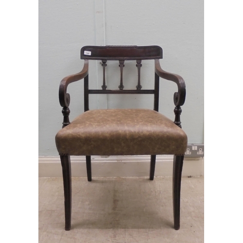 149 - An early 19thC mahogany framed chair with a rope carved bar crest, a triple bar splat back and reede... 