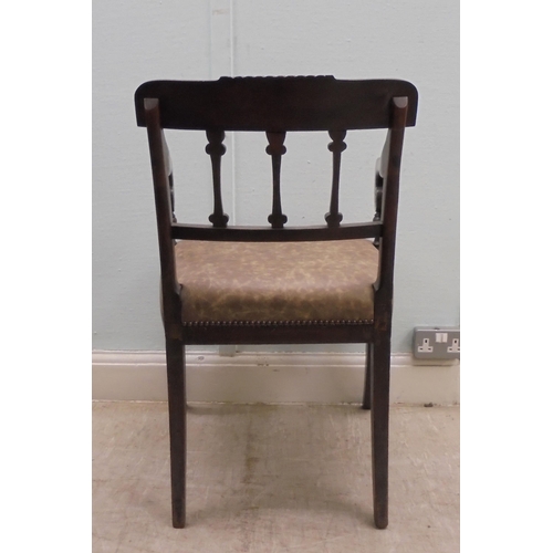 149 - An early 19thC mahogany framed chair with a rope carved bar crest, a triple bar splat back and reede... 