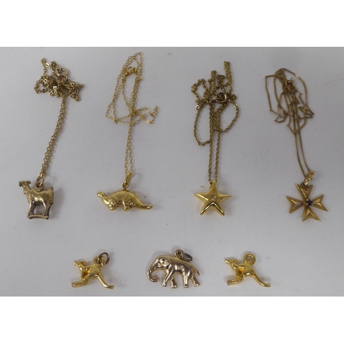 156 - Yellow metal items of personal ornament: to include  pendants, on fine neckchains