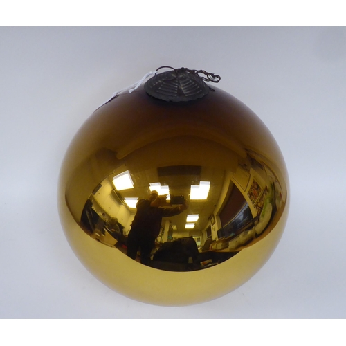 157 - A bronze coloured glass witches ball with a pendant connection  12