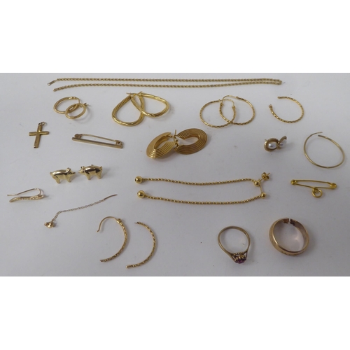 161 - Yellow metal items of personal ornament: to include half hoop earrings; a pendant cross; and a tiepi... 