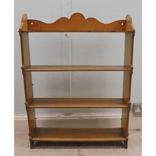 162 - An early 20thC planked satinwood four tier hanging bookcase with pegged ends  34