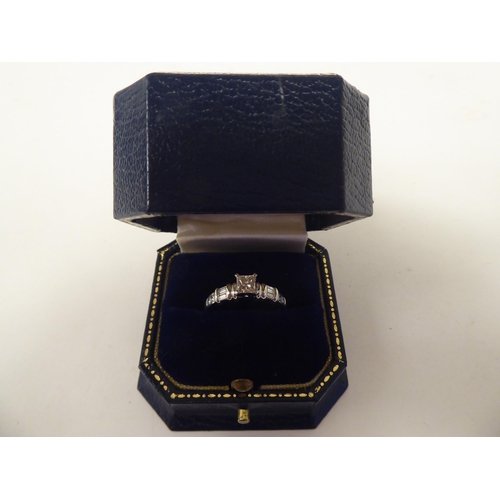 164 - A platinum and diamond set ring  boxed