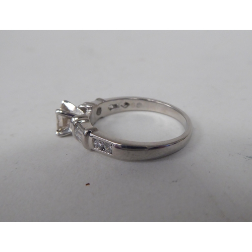 164 - A platinum and diamond set ring  boxed