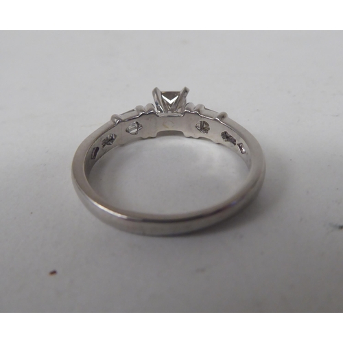 164 - A platinum and diamond set ring  boxed