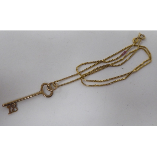 171 - An 18ct gold pendant, fashioned as an 18 Key, on a fine box link neckchain and ring bolt clasp