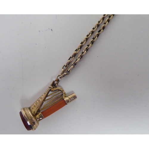 179 - A lady's Victorian gold fob watch key charm with a coral and cornelian set hasp design pendant seal