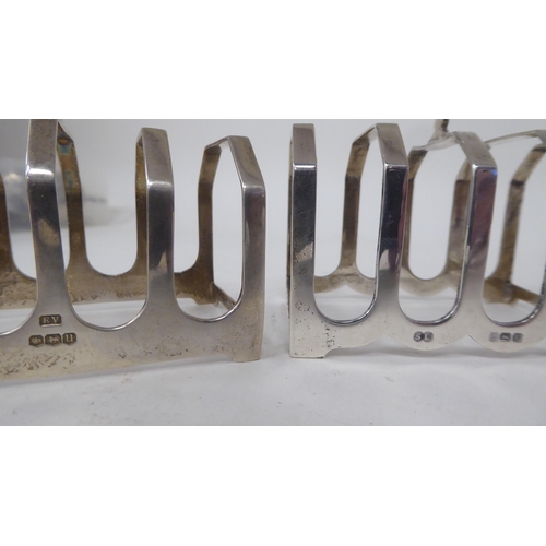 188 - Four similar silver four division toast racks  mixed marks  (combined weight approx. 5ozs)