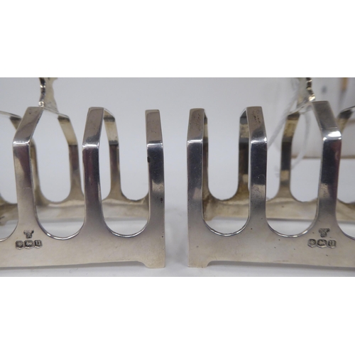 188 - Four similar silver four division toast racks  mixed marks  (combined weight approx. 5ozs)