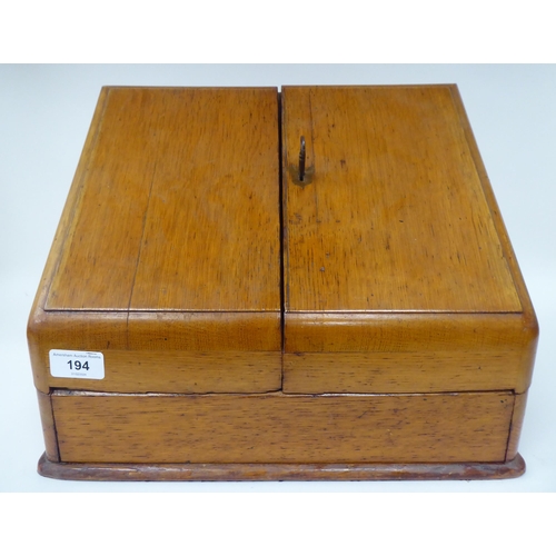 194 - A late Victorian/Edwardian Partridge & Cooper of Fleet Street, London, honey coloured oak deskto... 