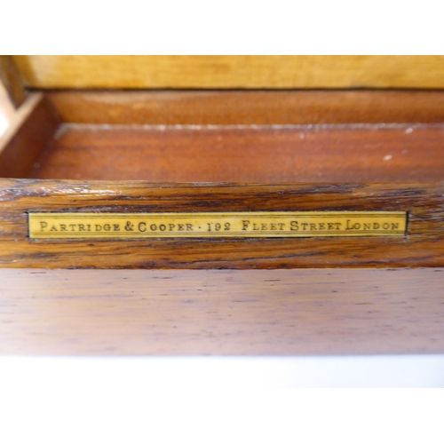 194 - A late Victorian/Edwardian Partridge & Cooper of Fleet Street, London, honey coloured oak deskto... 