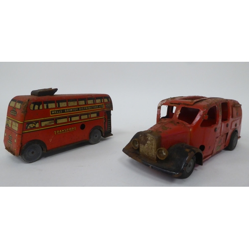 197 - Two vintage tinplate model toys, viz. a Brimtoy double decker trolley bus; and a Tri-ang Minic Toys ... 