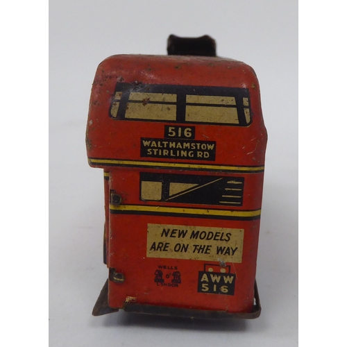 197 - Two vintage tinplate model toys, viz. a Brimtoy double decker trolley bus; and a Tri-ang Minic Toys ... 