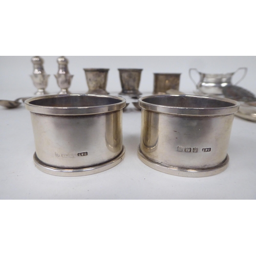 204 - Silver items: to include napkin rings; presentation and condiments spoons  mixed marks 