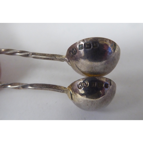 204 - Silver items: to include napkin rings; presentation and condiments spoons  mixed marks 