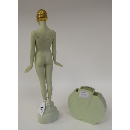 229 - Attributed to Glenis Devereaux - an Art Deco watered green Parianware figure, a posing nude wearing ... 