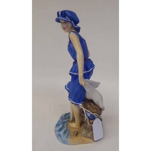 232 - A satin glazed china figure, featuring an Edwardian 'Bathing Beauty' designed by Glenis Devereaux  1... 