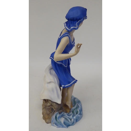 232 - A satin glazed china figure, featuring an Edwardian 'Bathing Beauty' designed by Glenis Devereaux  1... 