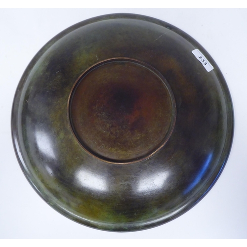 233 - A Just Anderson part-patinated green and brown bronze, footed, shallow dish with a double tramline e... 