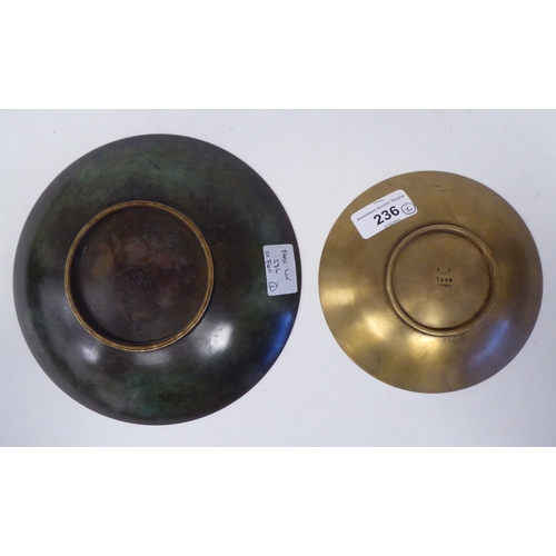 236 - A Just Anderson part-patinated green and brown bronze, footed, shallow dish with a narrow, flat rim ... 