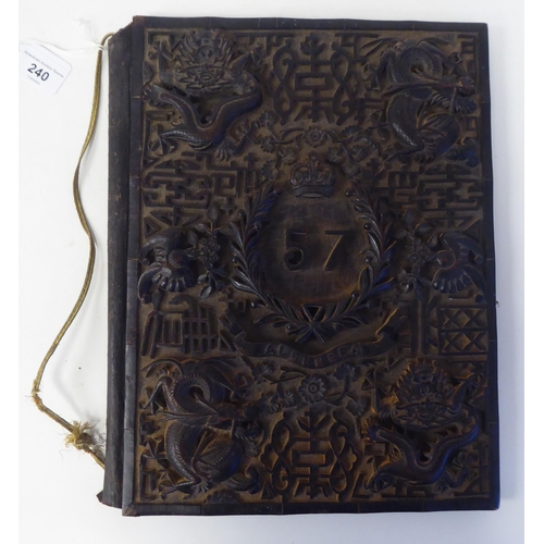 240 - A Victorian hardwood folio, the front cover finely carved in relief with the emblem of The 57th Regi... 