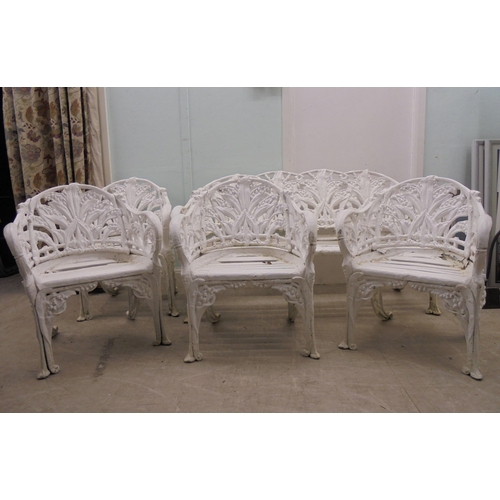 244 - A vintage Victorian inspired, white painted, cast metal suite of terrace furniture, in the style of ... 