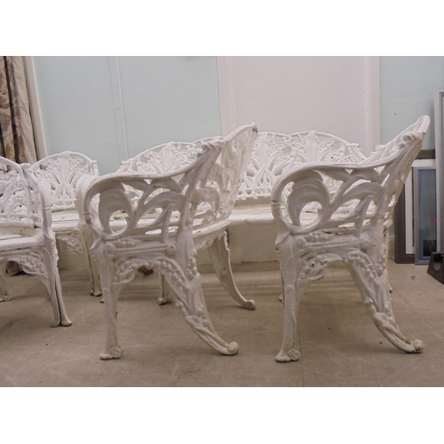 244 - A vintage Victorian inspired, white painted, cast metal suite of terrace furniture, in the style of ... 