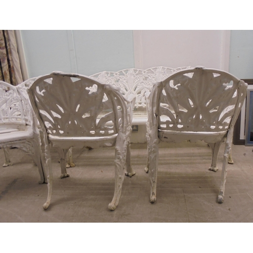 244 - A vintage Victorian inspired, white painted, cast metal suite of terrace furniture, in the style of ... 