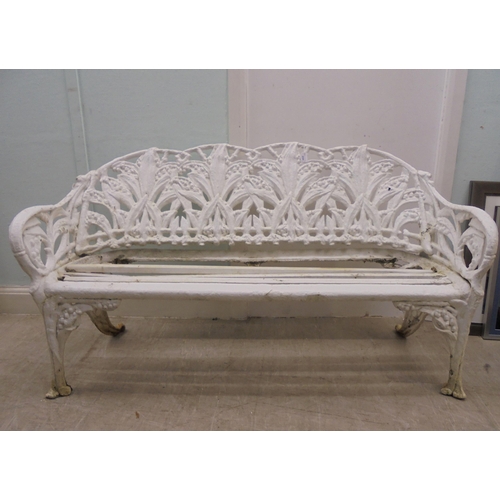 244 - A vintage Victorian inspired, white painted, cast metal suite of terrace furniture, in the style of ... 