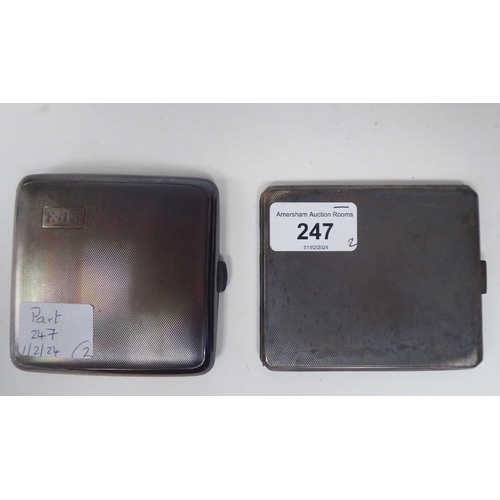 247 - Two similar silver, engine turned, folding cigarette cases, on button clasps  mixed marks