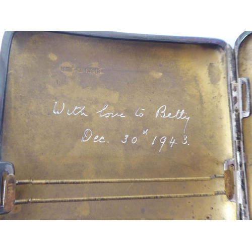 247 - Two similar silver, engine turned, folding cigarette cases, on button clasps  mixed marks