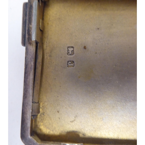 247 - Two similar silver, engine turned, folding cigarette cases, on button clasps  mixed marks