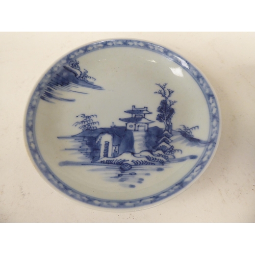 248 - A Nanking Cargo porcelain tea bowl and saucer, traditionally decorated in blue and white  bearing or... 