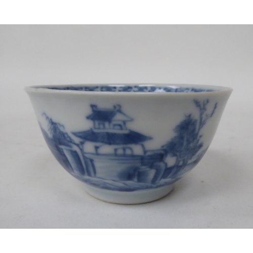 248 - A Nanking Cargo porcelain tea bowl and saucer, traditionally decorated in blue and white  bearing or... 