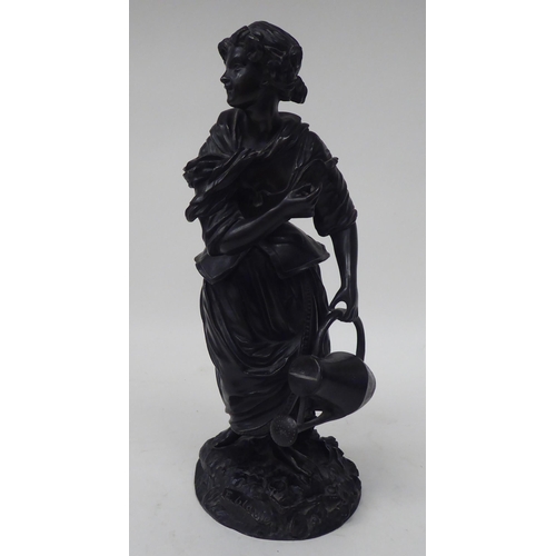 249 - E Blavier - a black painted bronze figure, a young woman holding a watering can, standing on a natur... 